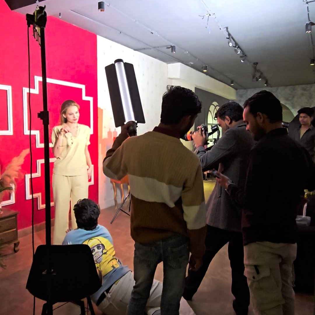 Model showcasing a clothing brand outfit during a product photography shoot